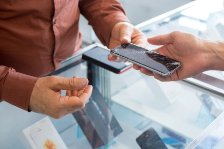 image of repairman fixing a phone
